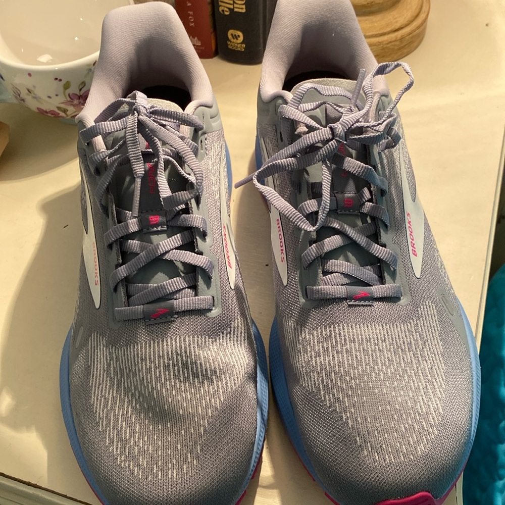 Brook’s tennis shoes almost new condition, worn once.  Gray and pink size 10